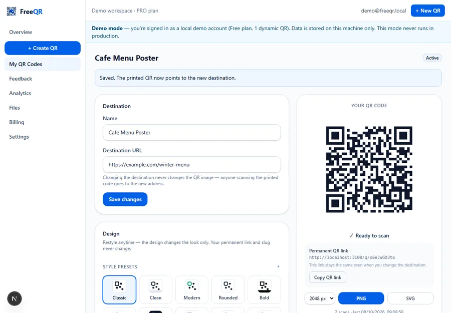 The same FreeQR QR detail page after editing the destination, showing a 'Saved. The printed QR now points to the new destination' message and the unchanged QR code image